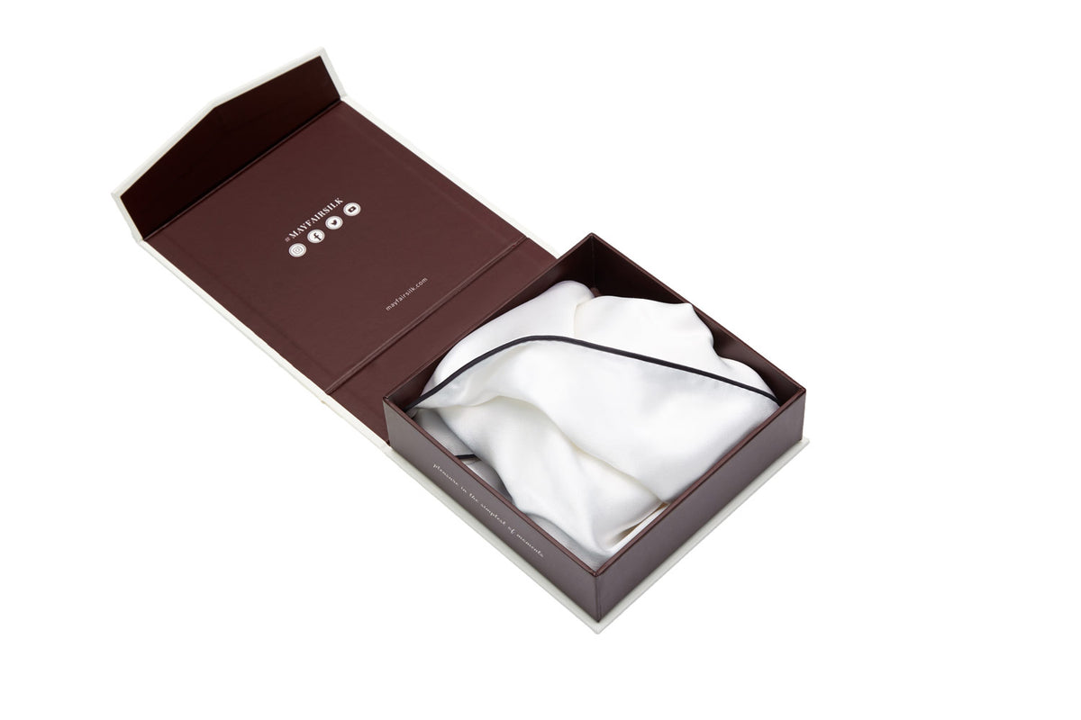 White silk pillowcase with charcoal border piping in a gift box
