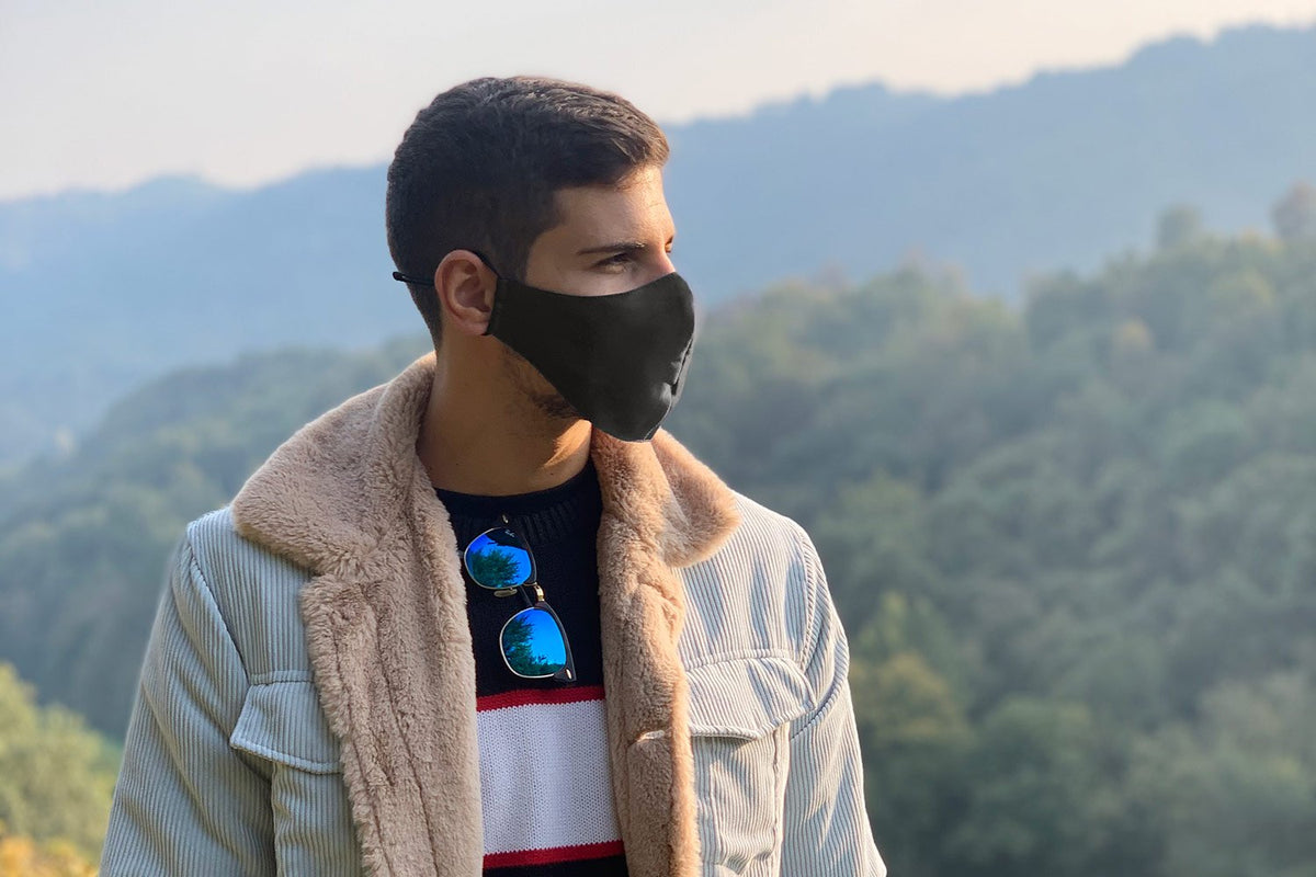 Man wearing a Charcoal Pure Silk Face Covering - MayfairSilk