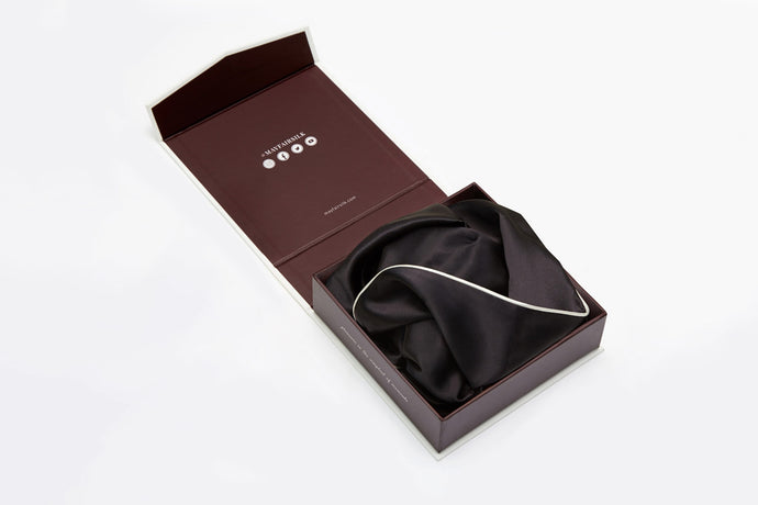 Charcoal silk pillowcase with ivory piping displayed in a gift box by Mayfairsilk