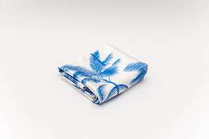 Folded Silk pillowcase with The Palms Blue print on ivory background