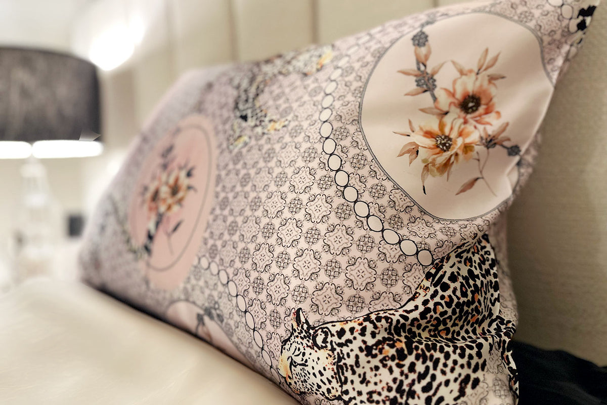 closeup of silk pillowcase with motifs, leopards and floral arrangements by Mayfairsilk