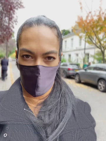 Video of girl wearing charcoal coloured silk face mask
