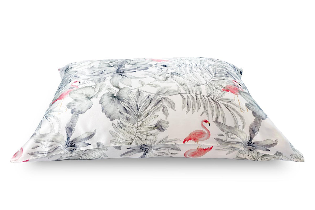 Side shot of a pillow dressed in a Flamingos silk pillowcase. 
