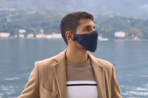Man wearing Midnight Blue Pure Silk Face Covering standing in front of a lake - MayfairSilk